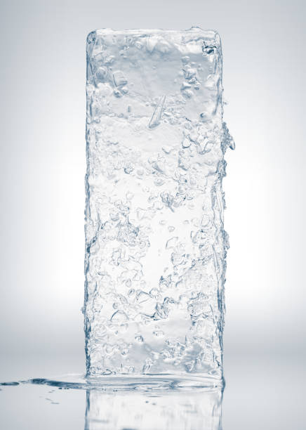 istock Crystal clear frosty textured natural ice block with cracks on black mirroring surface. 1461683105