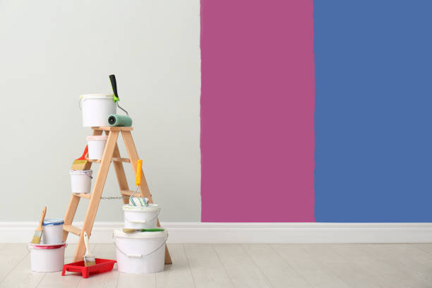 istock Decorator's kit of tools and paints near wall indoors 1461683215