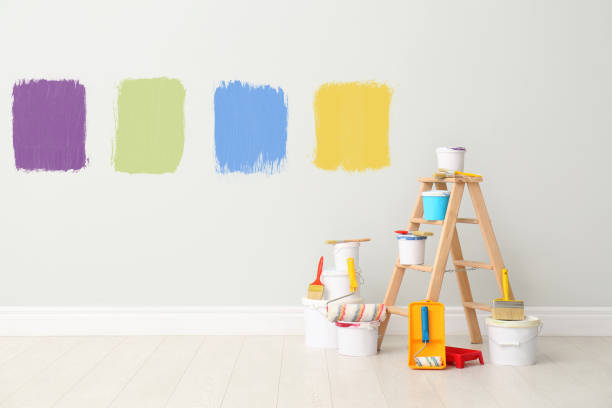istock Decorator's kit of tools and paints near wall indoors 1461683216