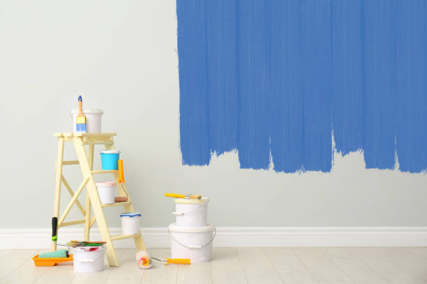 istock Decorator's kit of tools and paints near wall indoors 1461683318