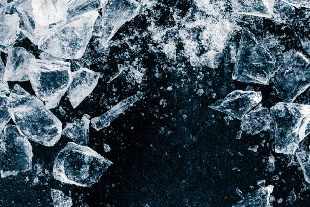 istock Ice cubes and crushed ice pieces on black background. Chill backdrop. 1461684960