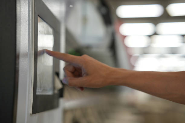 istock Worker touching automated screen on machine in factory 1461686637