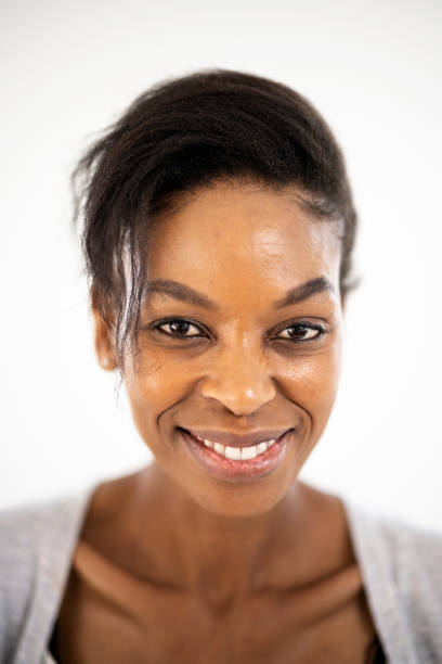 istock Close up studio portrait woman smiling at camera 1461686894