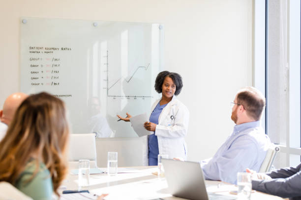 istock During her presentation, doctor answers question from staff 1461688426