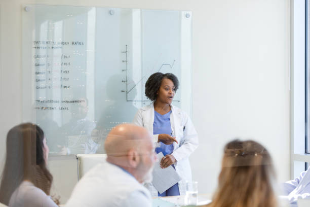 istock Female surgeon answers questions 1461688627
