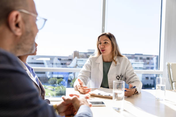 istock Hospital financial planner talks with family 1461688687