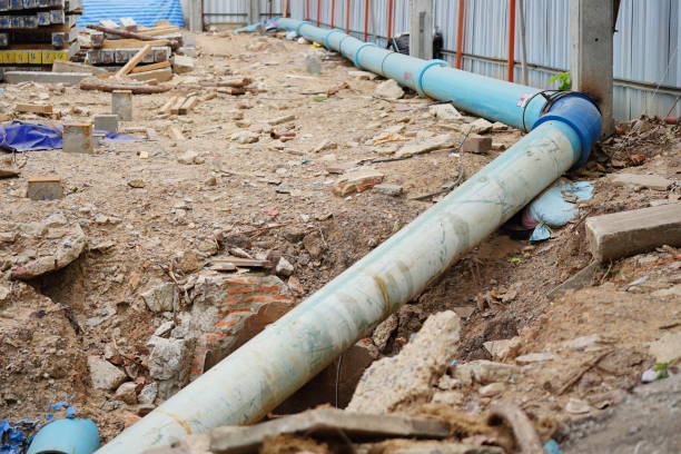 Construction site with new Water temporary pipes on the ground.