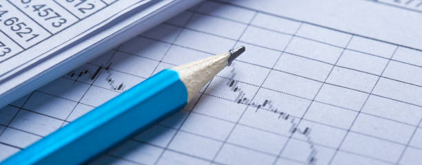 istock Checking the value of securities. Pencil, share listing and checking financial chart. Concept of banking, financial report and financial audit. 1461693659