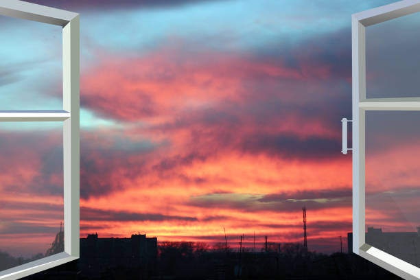 istock Plastic windows overlooking beautiful crimson sunset. View from home window 1461704124