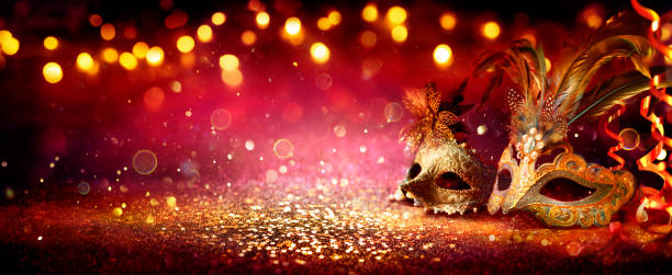 Carnival Party - Venetian Masks On Red Glitter With Shiny Streamers On Abstract Defocused Bokeh Lights Carnival - Venetian Mask Party - Masquerade Disguise With Shiny Streamers On Dark Defocused Glittering purple and gold masquerade masks stock pictures, royalty-free photos & images