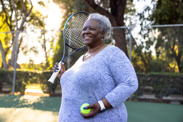 istock Senior Black Woman Playing Tennis 1461717720
