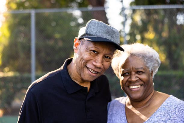 Senior Black Couple Walking Off the Tennis Court A senior black couple leaving the tennis court after their workout. tennis senior adult adult mature adult stock pictures, royalty-free photos & images
