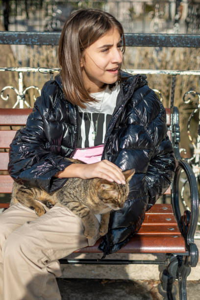 istock Beautiful girl enjoyment with her cat 1461727124