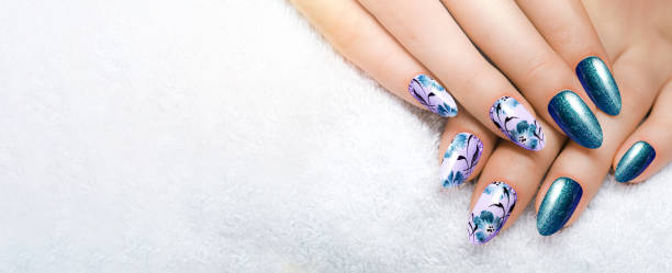 istock Blue flower manicure on long sharp nails close up on a white background. Gel nails. 1461734855