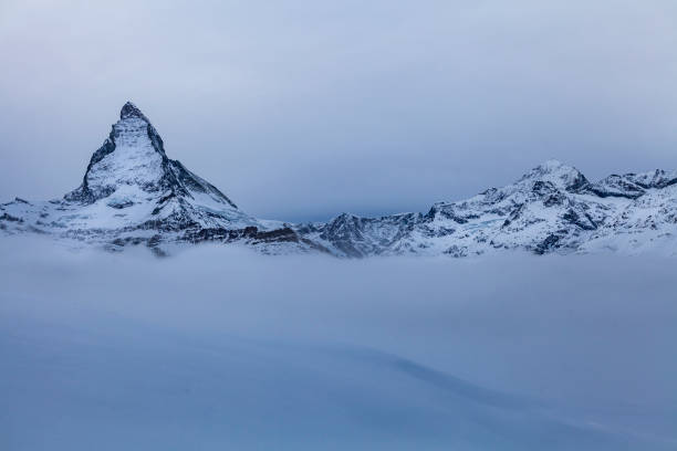beautiful matterhorn mountain peak in the fog. the peak is 4477 meters above sea level, located near zermatt village in switzerland europe.