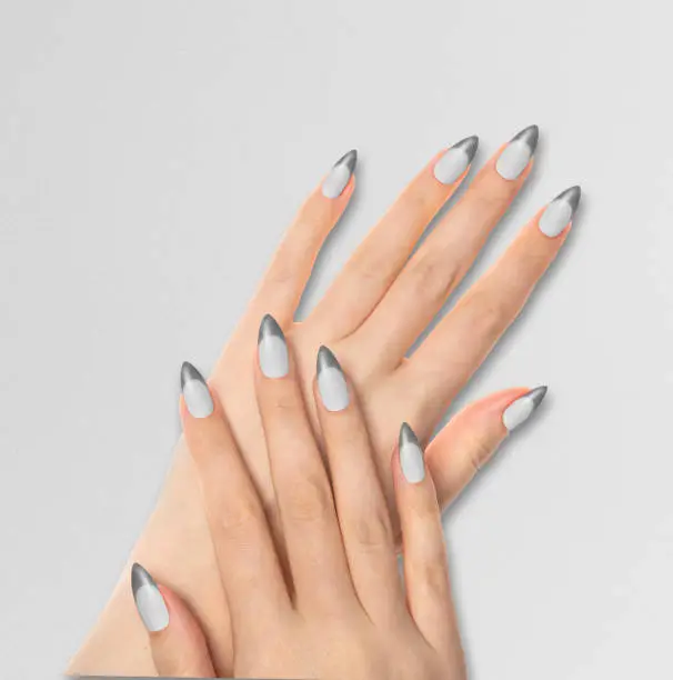 Hands With Bright Gray Manicure On light Gray Background. Close Up Of Female Hands With Trendy Gray Nails On Gray Background.
