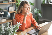 Mature adult woman working at home (laptop