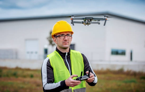 istock Engineer with flying drone. Concept of cybernetics and robotics 1461760328