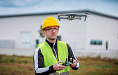 Engineer with flying drone. Concept of cybernetics and robotics