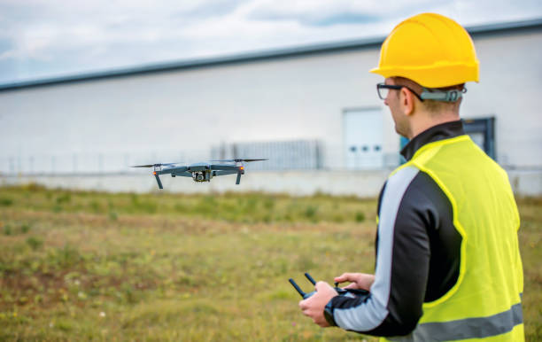 Engineer with flying drone. Concept of cybernetics and robotics