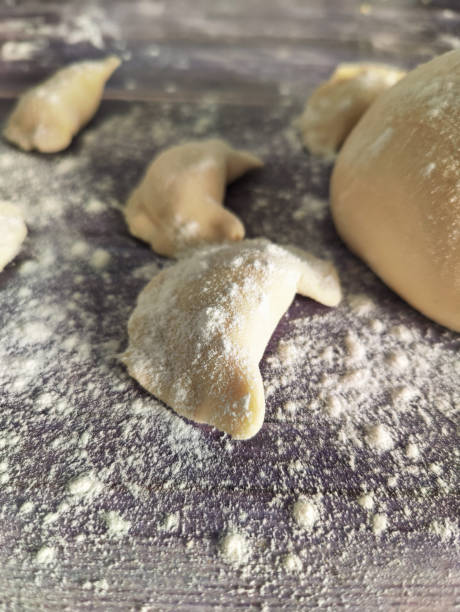 istock Homemade raw dumplings with potatoes on a wooden table 1461761399