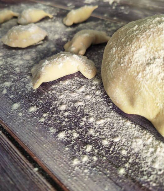 istock Homemade raw dumplings with potatoes on a wooden table 1461761490