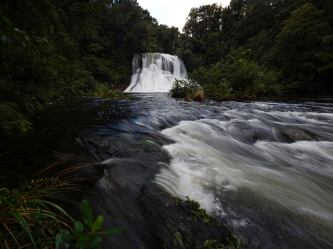 Long exposure shot of Aniwaniwa Falls waterfall near Lake Waikaremoana in Te Urewera National Park Hawkes Bay North Island New Zealand