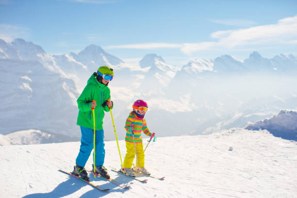 istock Ski and snow fun for kids in winter mountains 1461765643