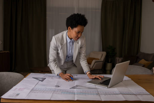 istock Mid adult female  designer working on a big project 1461770885