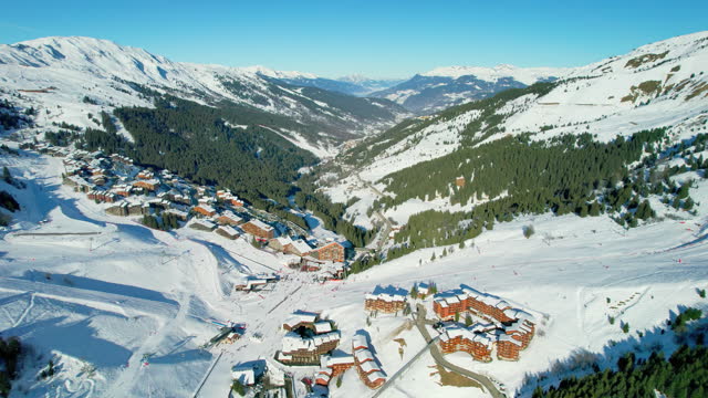 Meribel, France: Aerial view of slopes richly covered with snow, famous ski resort in French Alps (Savoie Alps) mountains in winter - landscape panorama of Europe from above