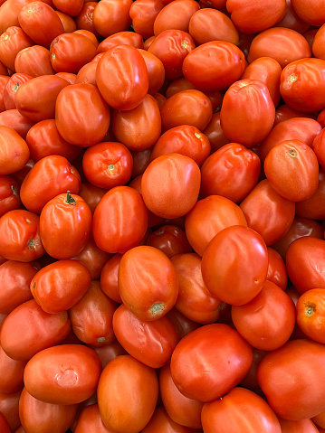 Heap of red roma tomatoes
