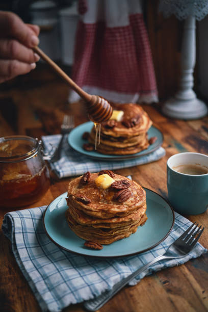 istock Sweet Potato Pancakes with Butter, Pecans and Maple Syrup 1461784221