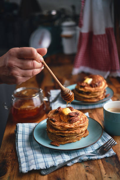 istock Sweet Potato Pancakes with Butter, Pecans and Maple Syrup 1461784233