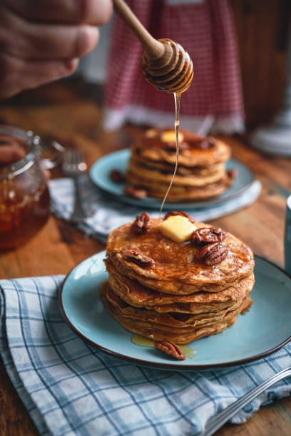 istock Sweet Potato Pancakes with Butter, Pecans and Maple Syrup 1461784290