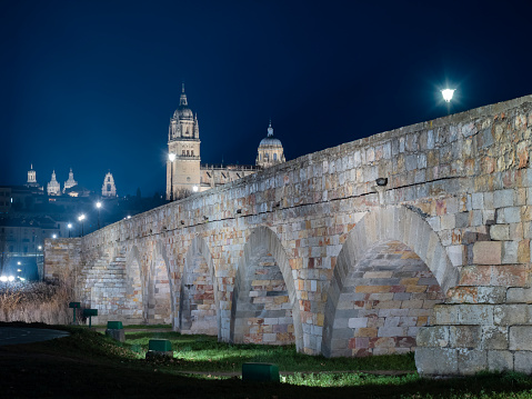 Night view of the roman bridge of Salamanca, Spain