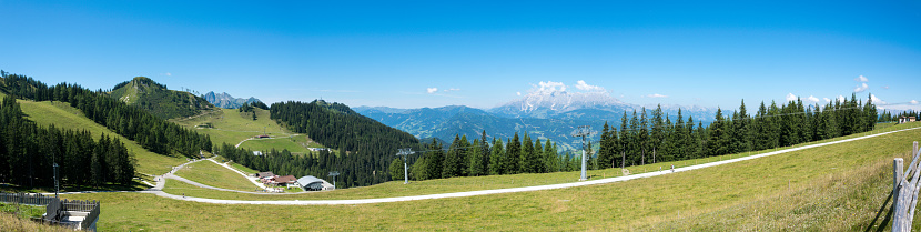 Panorama of the Dachstein mountain range in the Austrian Alps in summer on the mountains.