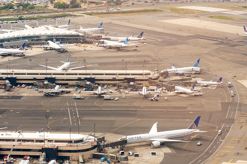 8/17/2022:  Newark Liberty Airport, Newark, New Jersey, USA - EWR - Aerial view of United Airlines jets loading at Newark Airport EWR