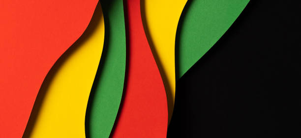 istock Black History Month color background. Abstract paper cut style composition with layers of geometric shapes and wavy lines in red, yellow, green colors 1461787541