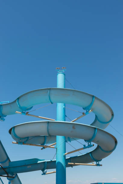istock view on a blue water slide against a clear blue sky 1461787611