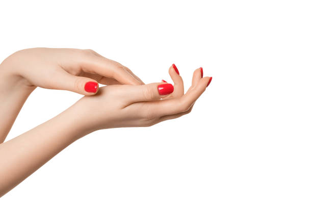 istock Beautiful, well-groomed female hands with a manicure on a white background, isolate. Red nail polish. 1461789946