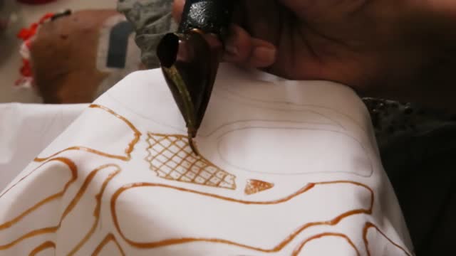 Details of Making Traditional Batik with the hand canting of Jakarta's