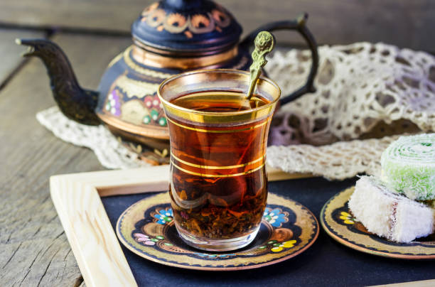 istock Turkish tea set: glass cup of tea and copper teapot 1461790378