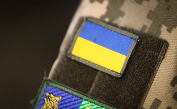 A patch with the flag of Ukraine A patch with the flag of Ukraine on a military uniform patriotic quilt stock pictures, royalty-free photos & images