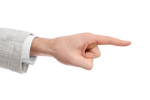 Man pointing with index finger on white background, closeup