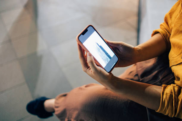 istock An Unrecognizable Woman Watching Something On Mobile Phone While Sitting Outdoors At Night 1461794142