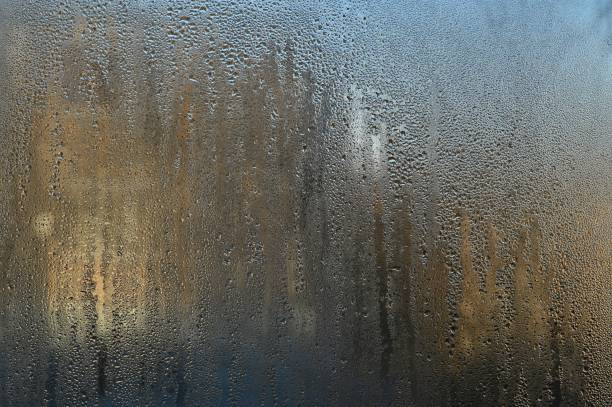 istock wet glass with textured water droplets on it 1461796071