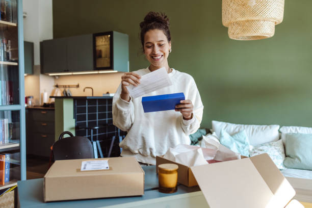 Young woman received a subscription box stock photo