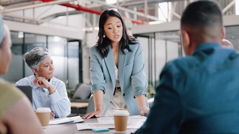 Business meeting, business people and leadership with question in collaboration, company staff and project strategy. Planning, schedule and woman leader with diversity, team and corporate paperwork.