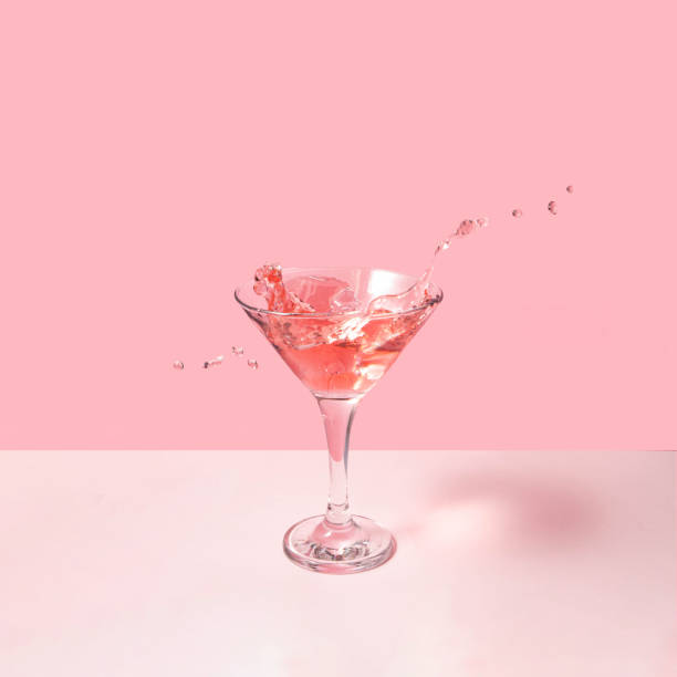 istock Tasty cocktail on pastel light pink background. Creative drink concept. Minimalistic beverage composition. 1461807274