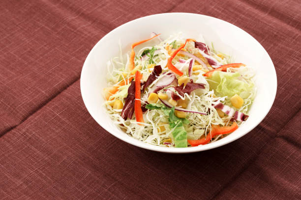 istock Shredded cabbage and colorful vegetable salad 1461832208